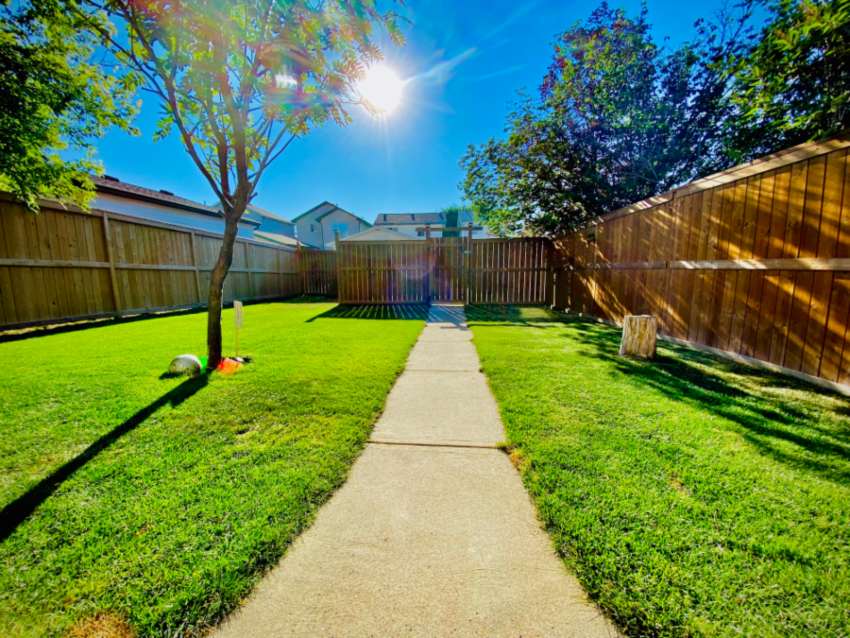 House back yard with wooden fencing